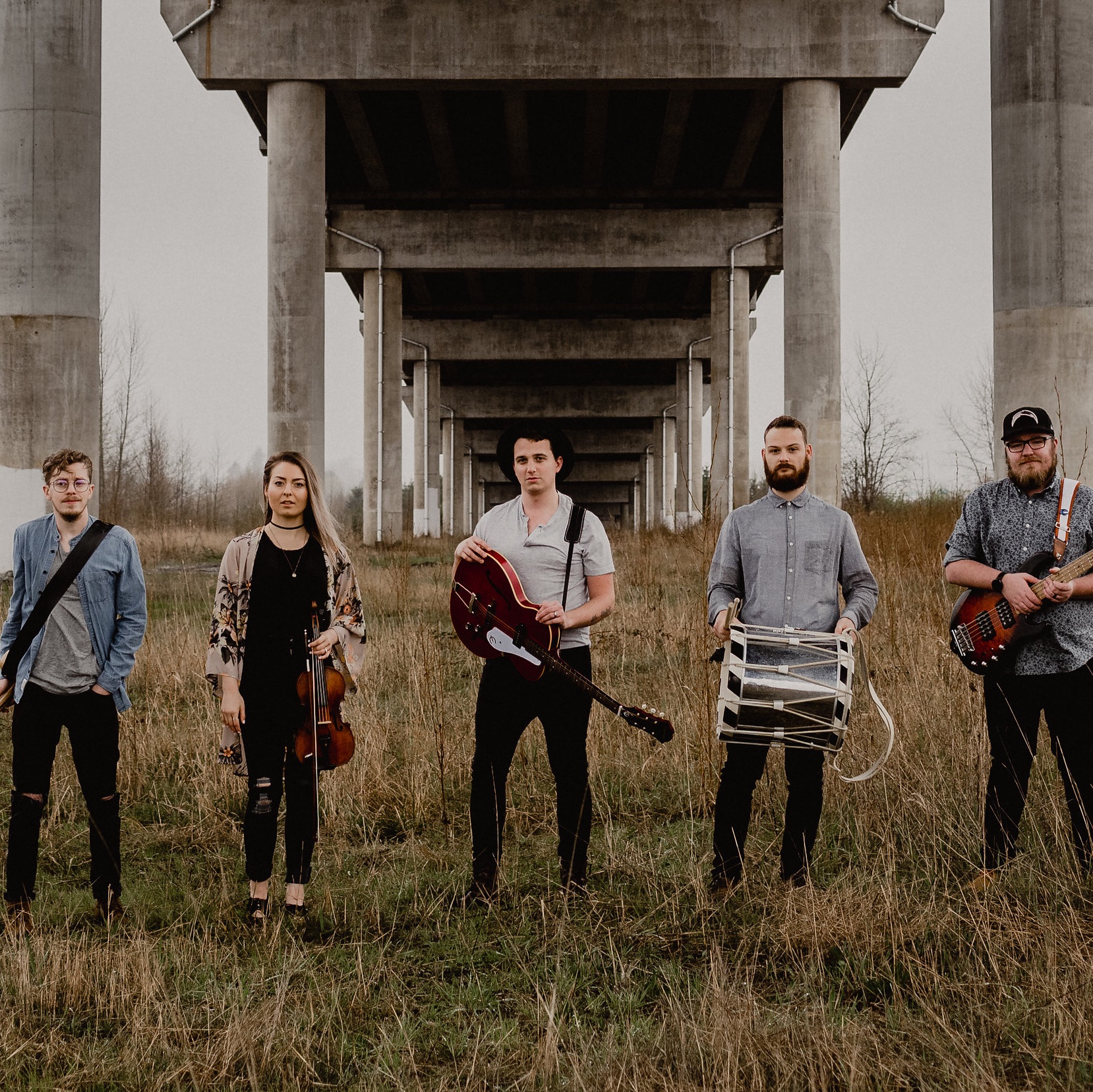 The band, Dear One, posing majesticly under a bridge.